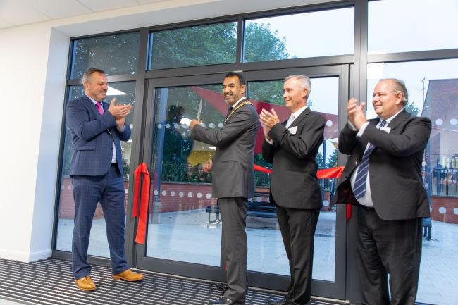 Andrew McGinnes (Headteacher), Councillor Zahir Mohammed (Chairman of the Council), Matthew Watkins (Chair of Governors), and Councillor John Chilver (Cabinet Member for Finance, Resources, Property and Assets) cut the ribbon at the opening ceremony
