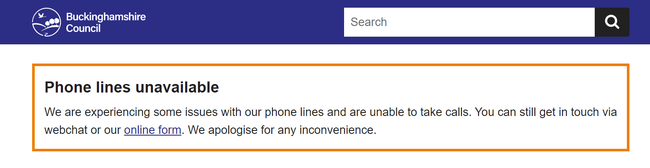 An example of an orange website alert banner telling users that the phone lines are down