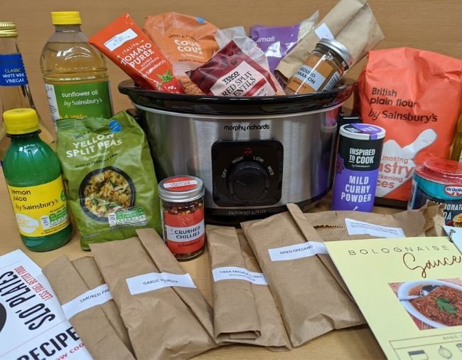 Various food items spread out on a wooden table